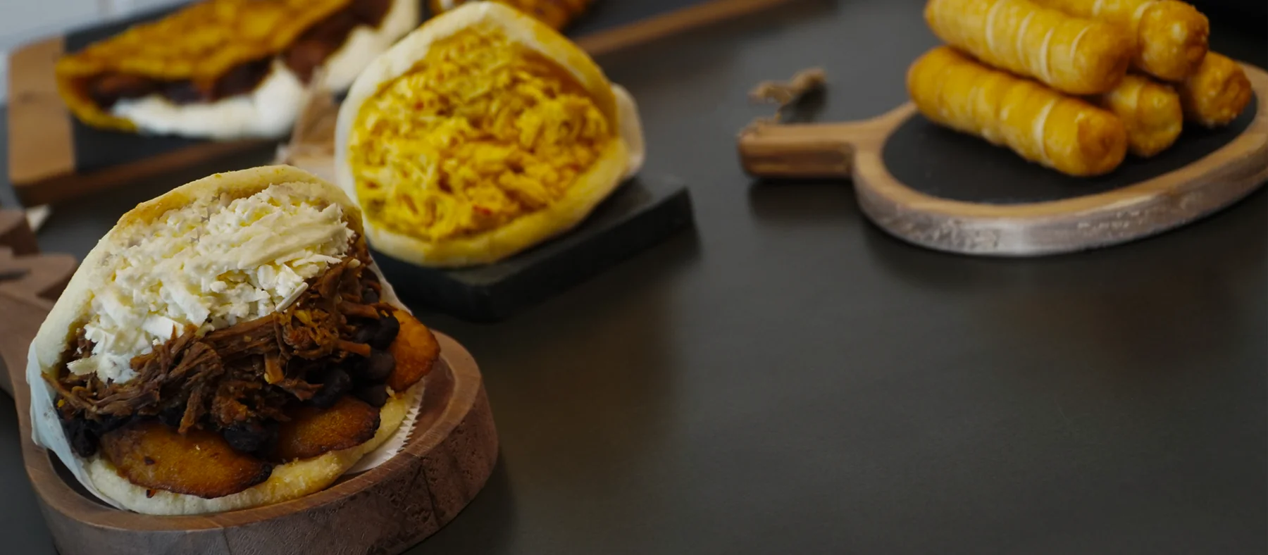 Freshly filled arepas and golden tequeños at TequeArepa